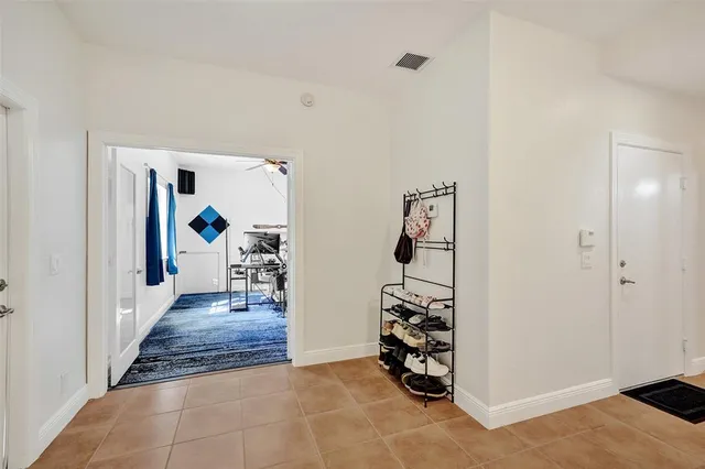 walk in closet with white walls