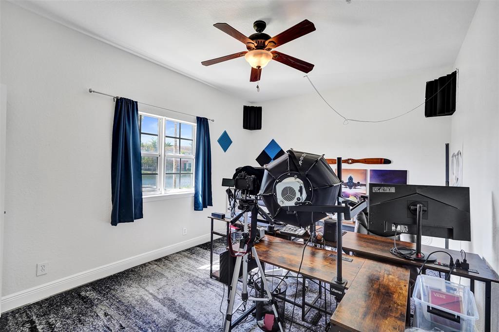 228 Southwest 6th Court Pompano Beach, FL 33060 - Photo 9 of 50 a workspace with furniture hardwood and a window