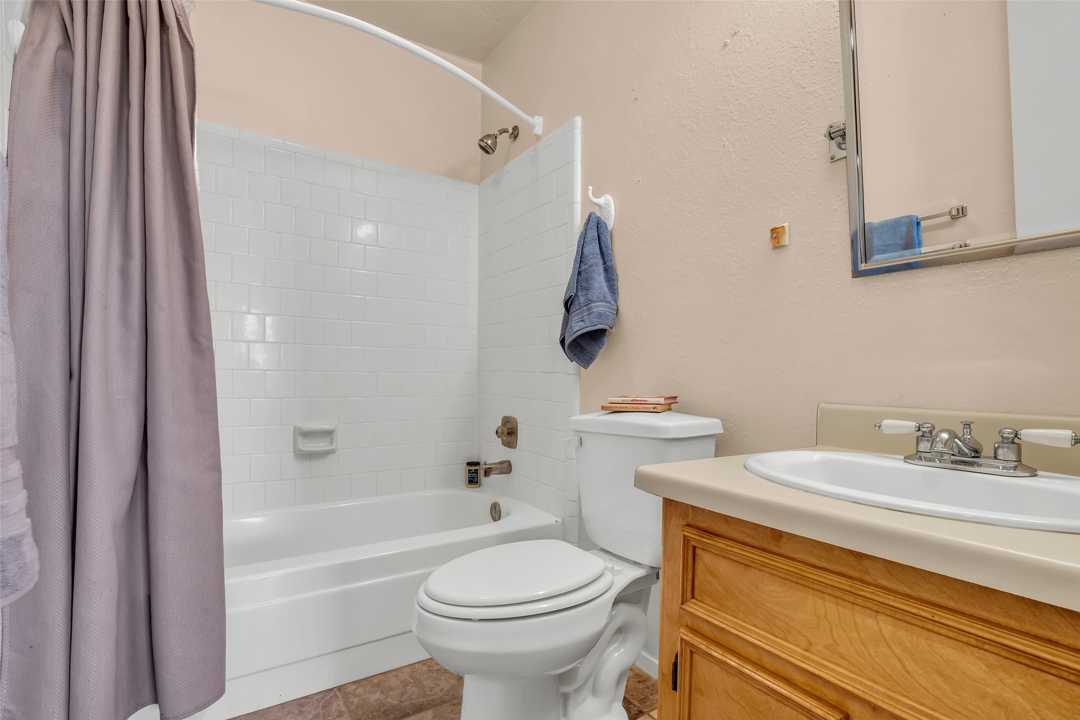 32134 Robin Lane Waller, TX 77484 - Photo 15 of 25 a bathroom with a sink a toilet and a bathtub