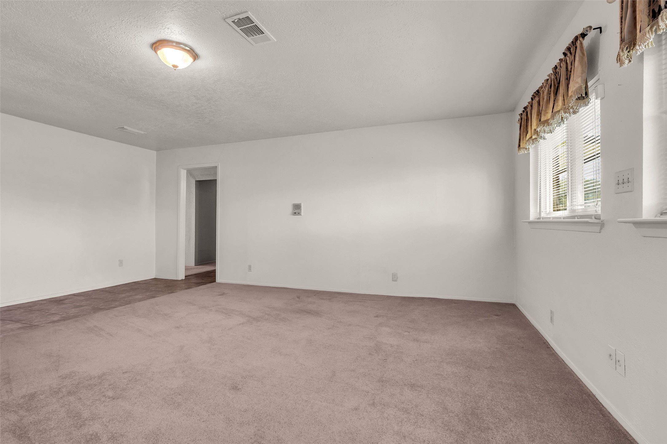 32134 Robin Lane Waller, TX 77484 - Photo 18 of 25 an empty room with windows