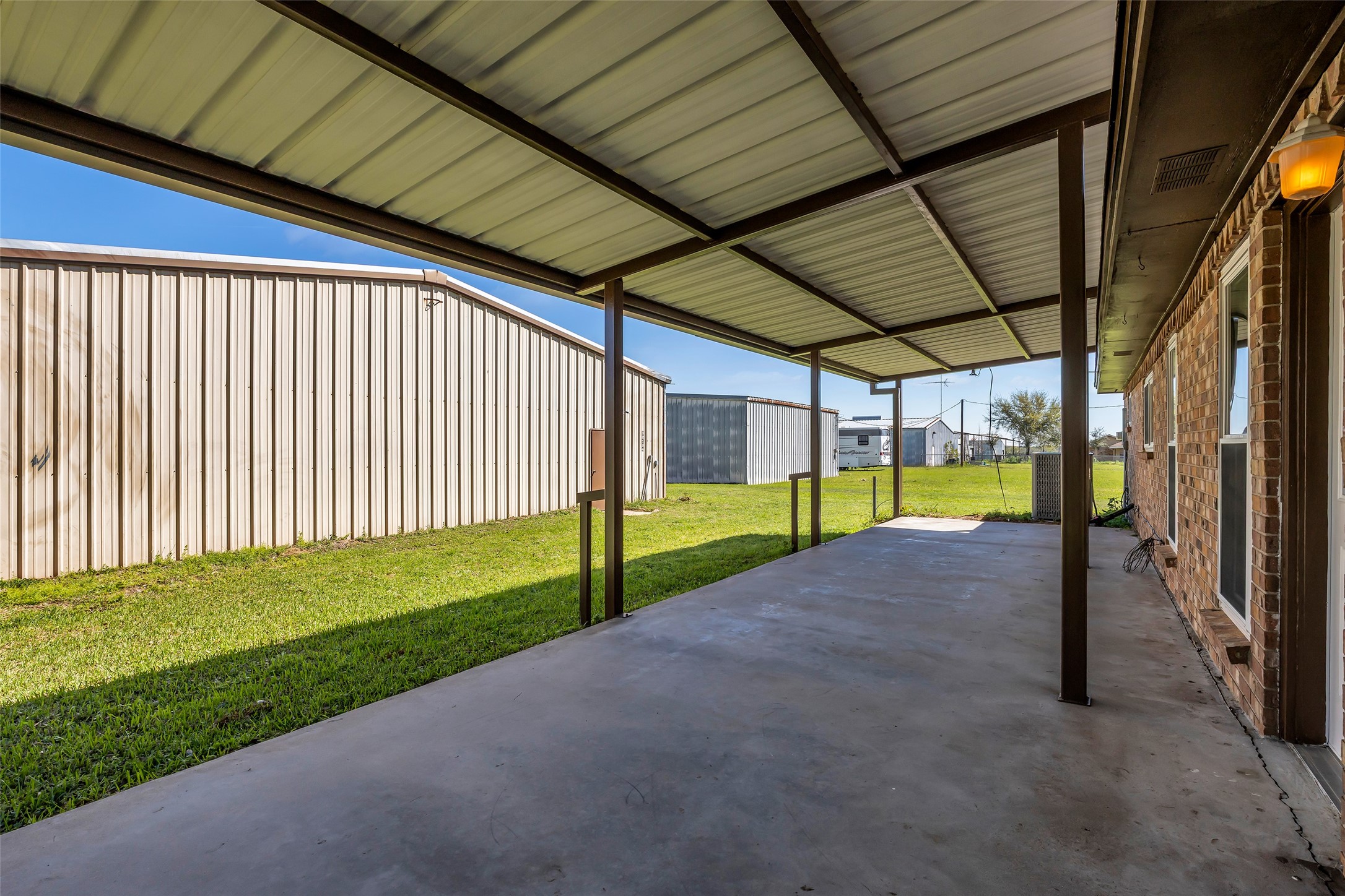 32134 Robin Lane Waller, TX 77484 - Photo 22 of 25 a view of a backyard with porch