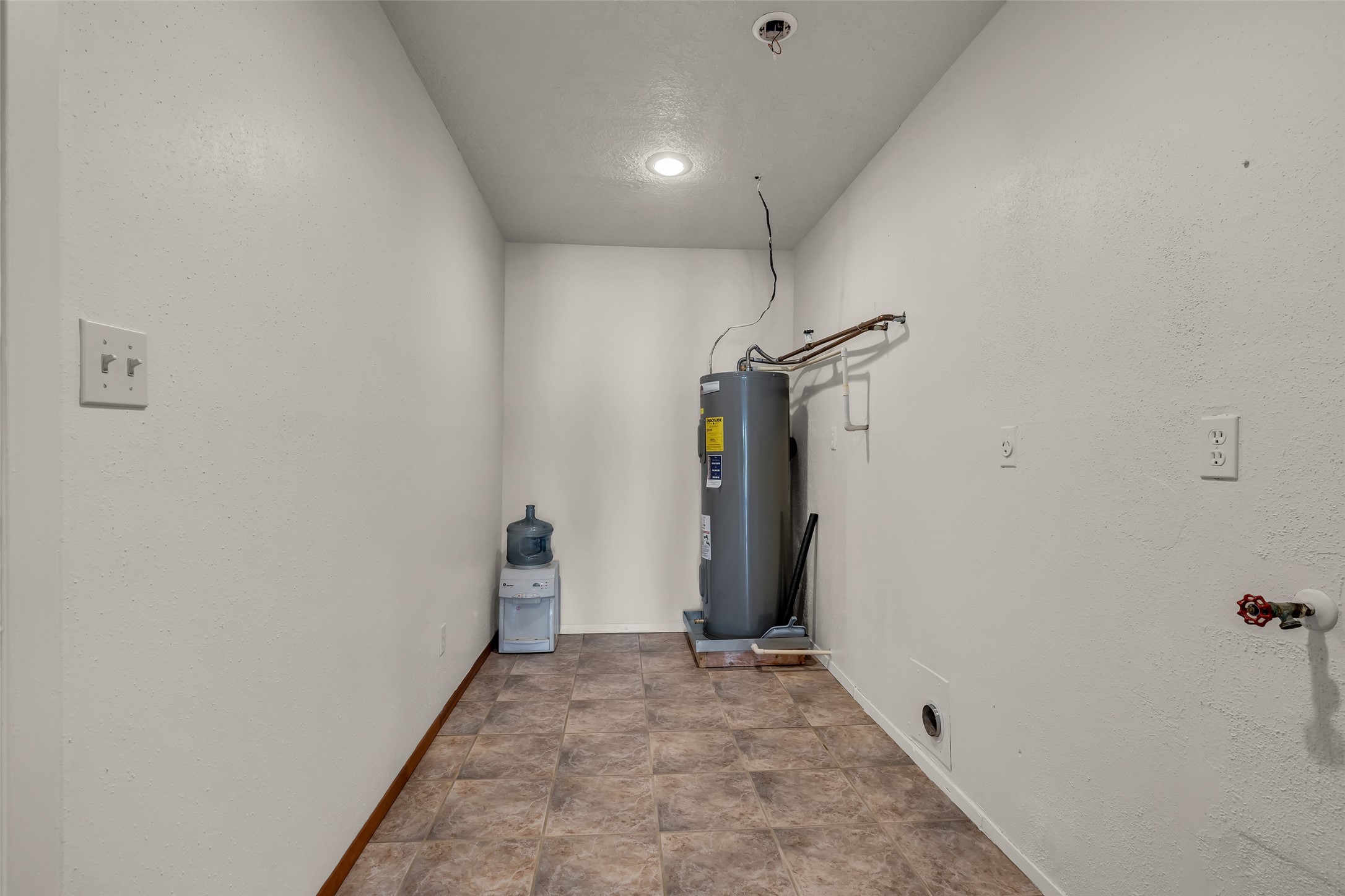 32134 Robin Lane Waller, TX 77484 - Photo 24 of 25 a view of hallway with closet and a white door