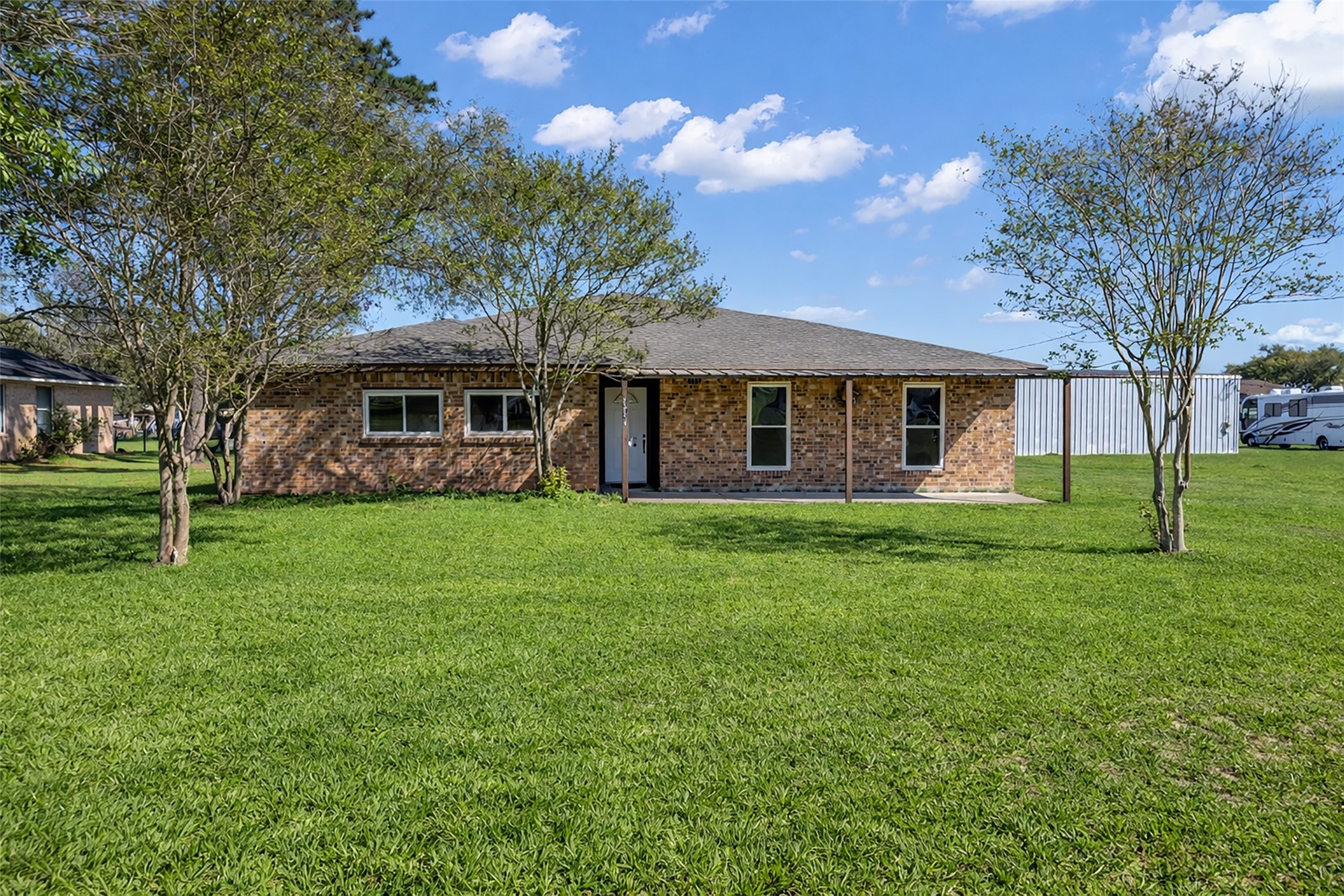 32134 Robin Lane Waller, TX 77484 - Photo 3 of 25 a front view of a house with a garden
