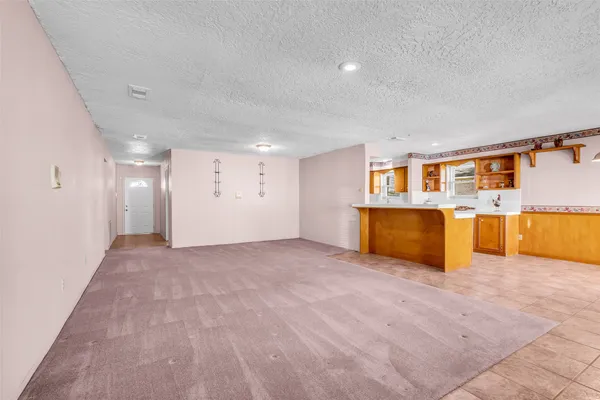 a view of hallway with closet and a white door