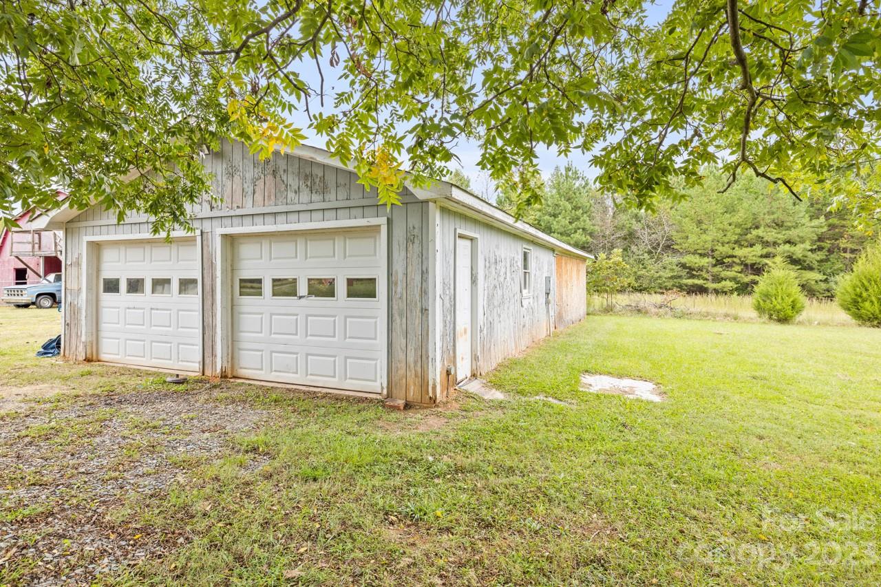 2218 Goldmine Road Monroe, NC 28110 - Photo 42 of 42 a view of a house with backyard and tree