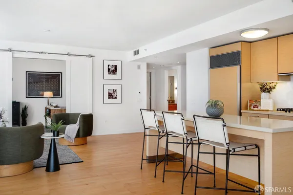 a view of a livingroom with furniture and a flat screen tv