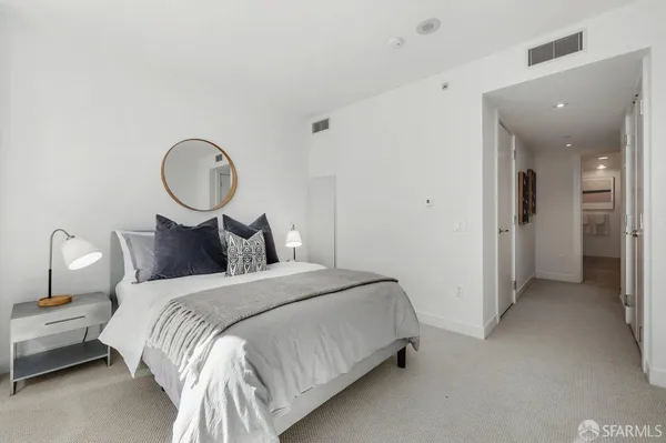 a bed room with a bed and a chandelier