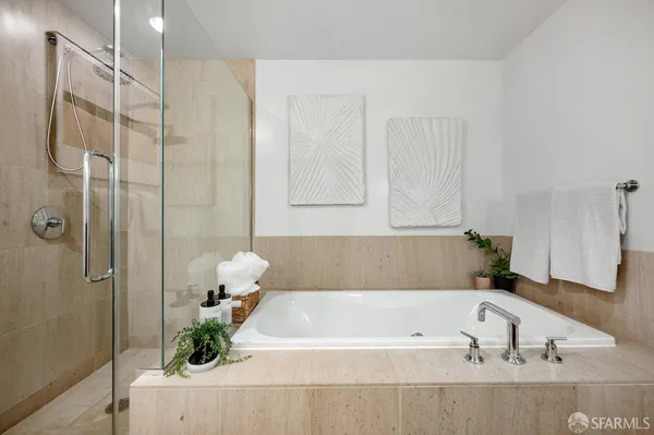 a bathroom with a bathtub and shower