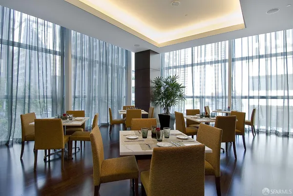 a view of a dining room with furniture window and wooden floor