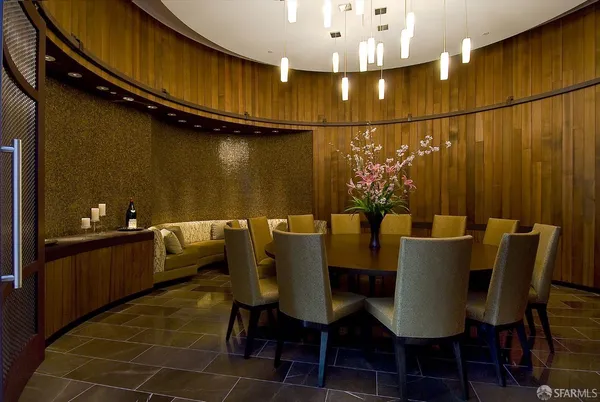 a view of a dining room with furniture and chandelier