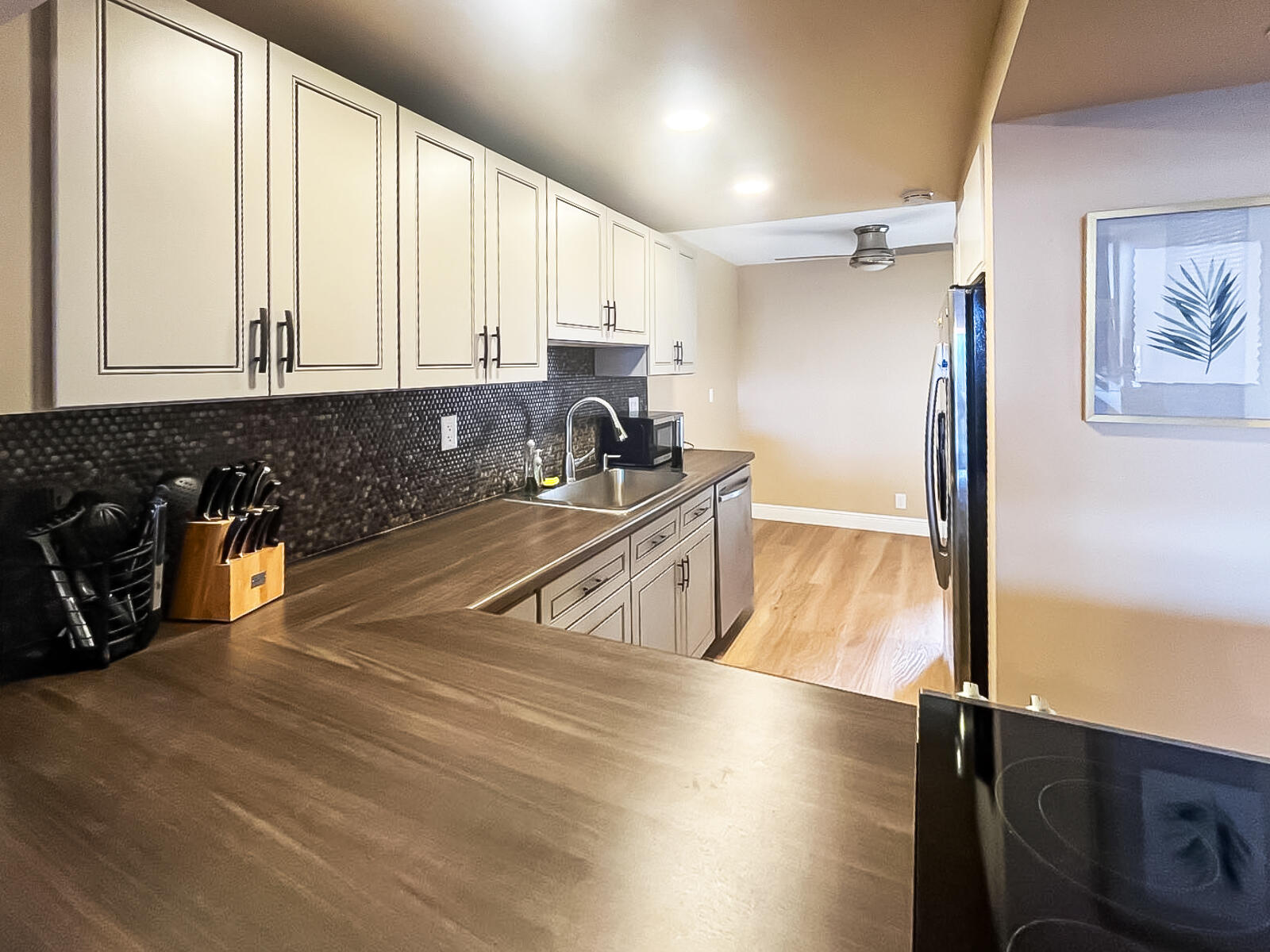 6 Royal Palm Way, Unit 310 Boca Raton, FL 33432 - Photo 12 of 37 a kitchen with stainless steel appliances granite countertop a sink a stove and a refrigerator