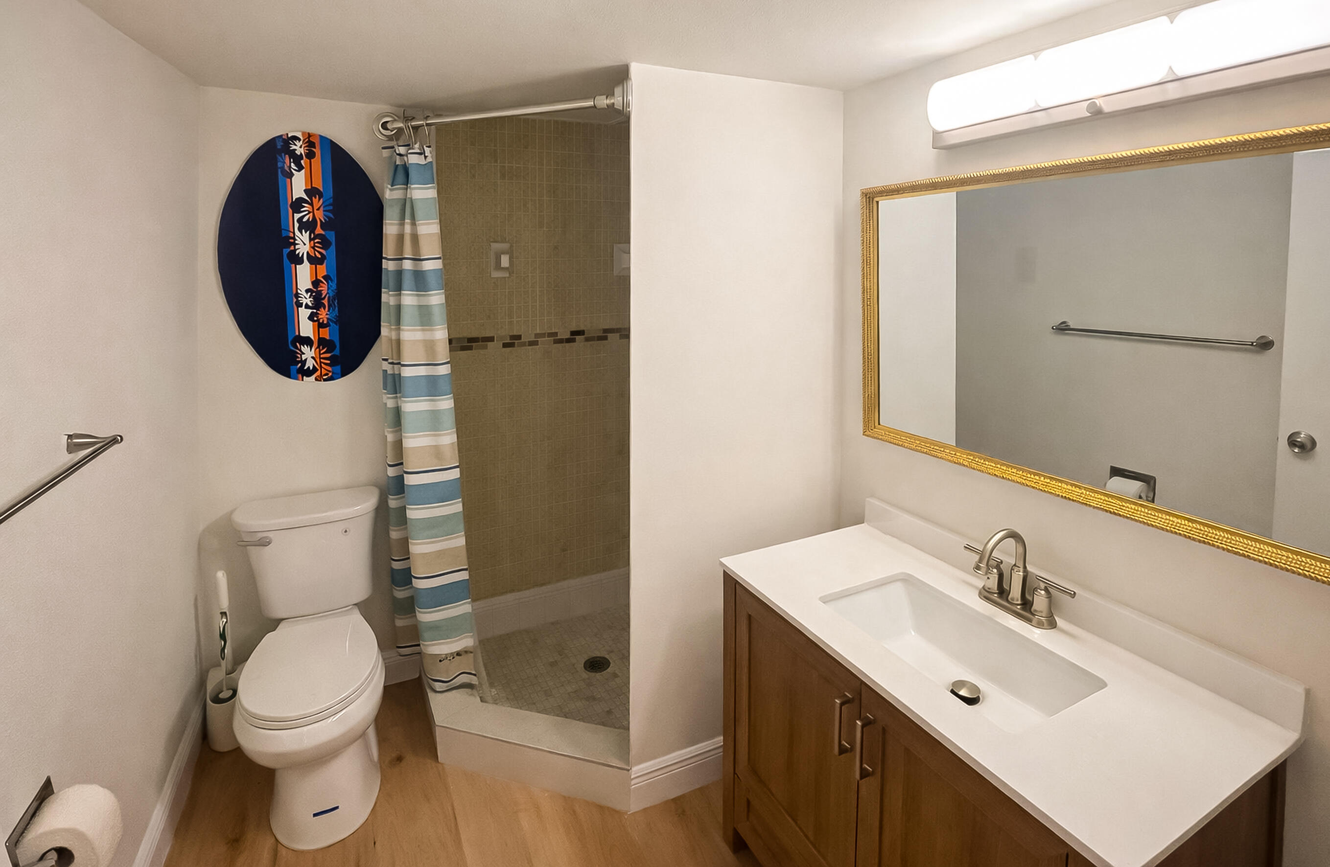 6 Royal Palm Way, Unit 310 Boca Raton, FL 33432 - Photo 19 of 37 a bathroom with a toilet sink vanity and mirror