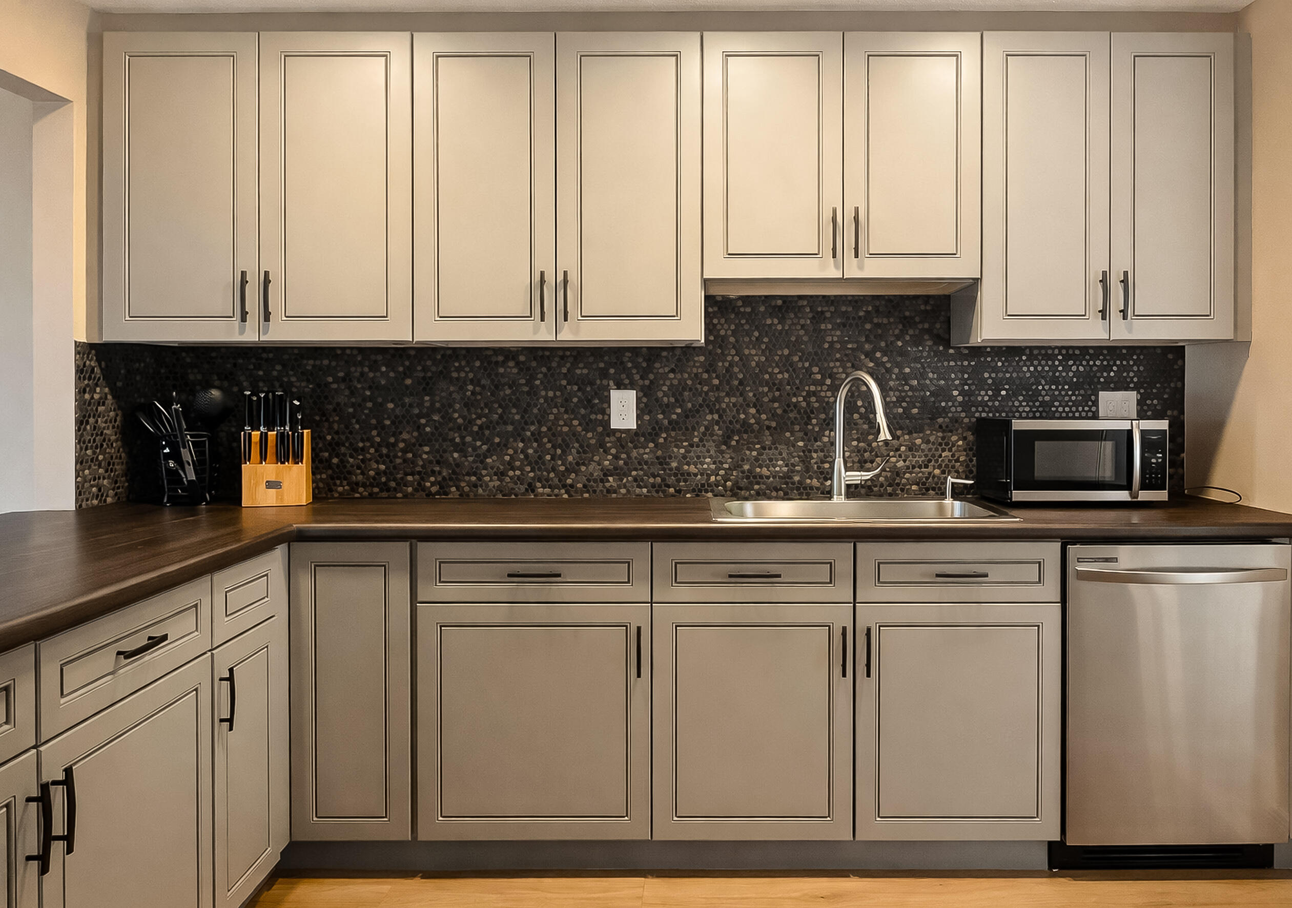 6 Royal Palm Way, Unit 310 Boca Raton, FL 33432 - Photo 2 of 37 a kitchen with white cabinets and sink
