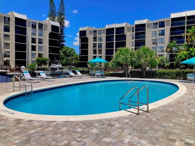 6 Royal Palm Way, Unit 310 Boca Raton, FL 33432 - Photo 25 of 37 a view of a swimming pool with a lounge chairs