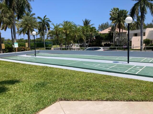 6 Royal Palm Way, Unit 310 Boca Raton, FL 33432 - Photo 26 of 37 a view of a swimming pool and a longer chairs