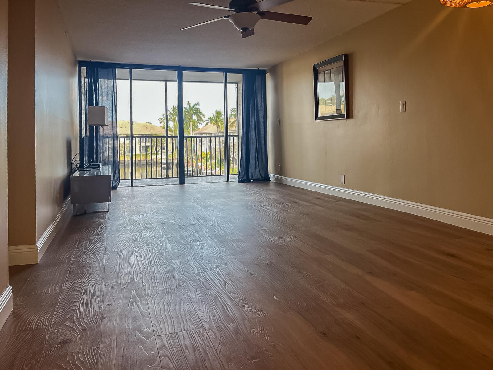 6 Royal Palm Way, Unit 310 Boca Raton, FL 33432 - Photo 5 of 37 wooden floor in an empty room with a window