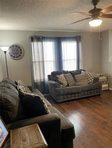 a bedroom with a bed couch and window