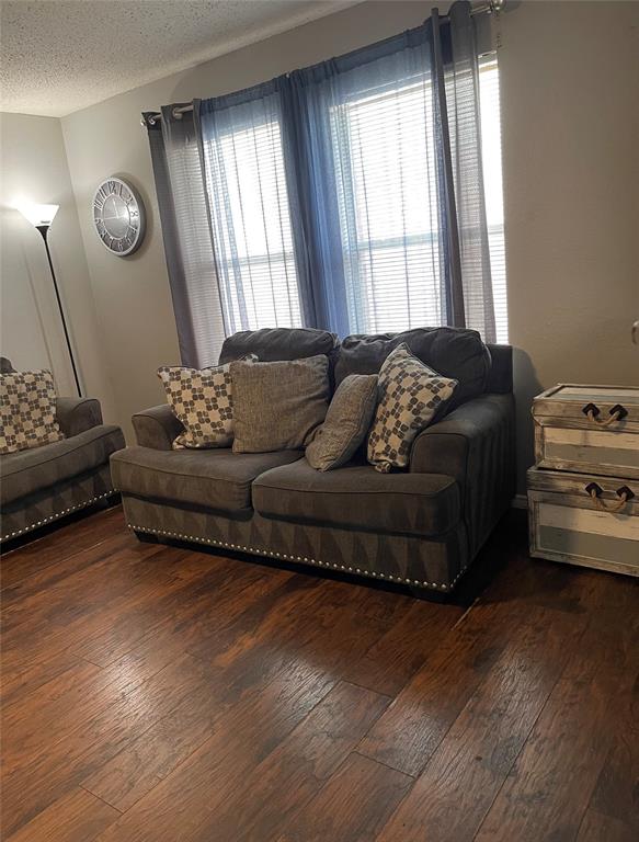 7554 Rice Lane Dallas, TX 75241 - Photo 6 of 16 a living room with furniture and window