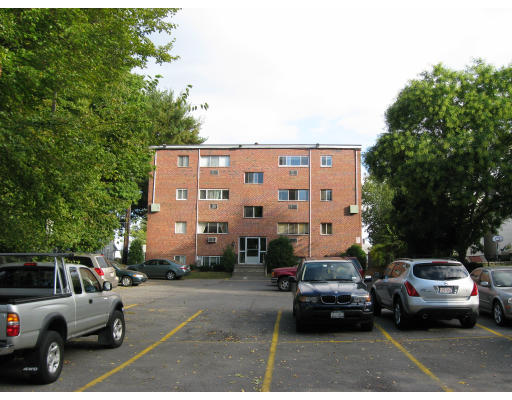 1409 River Street, Unit 23 Boston, MA 02136 - Photo 3 of 6 a view of parking with cars parked