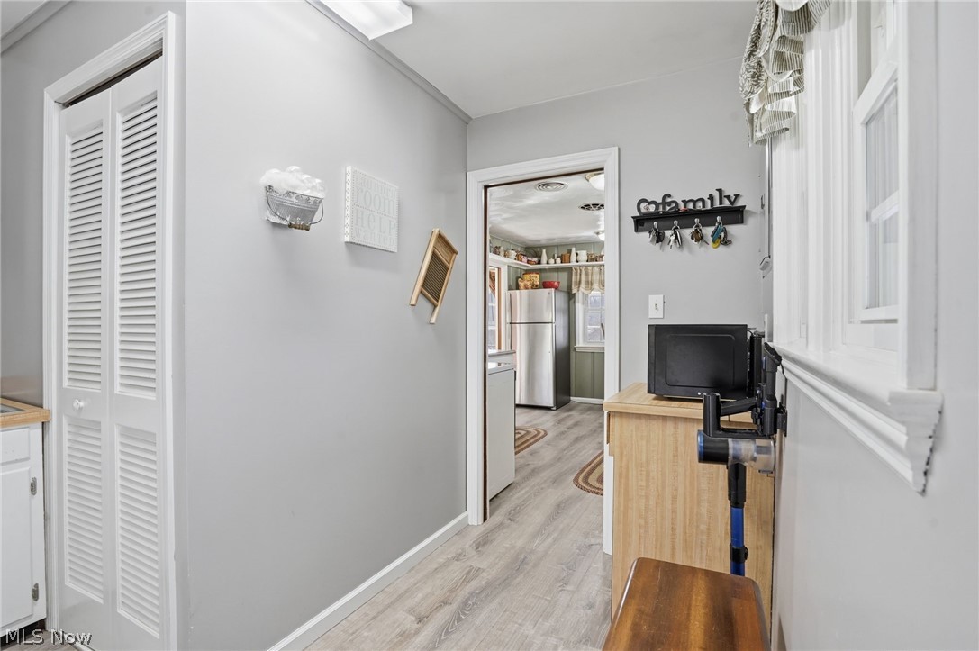 6655 Ceramic Road Crooksville, OH 43731 - Photo 25 of 34 Hall featuring light wood-type flooring and baseboards