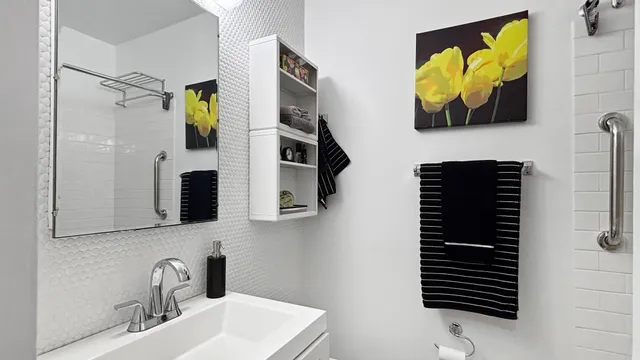 a bathroom with a sink and mirror