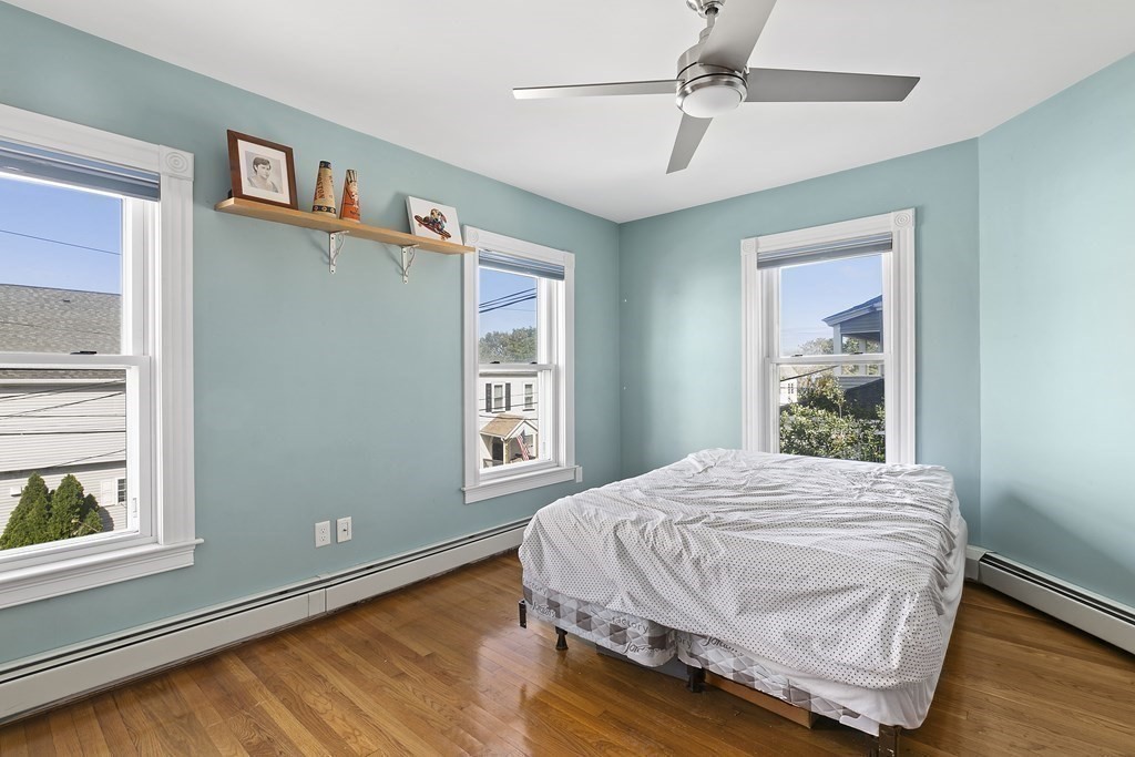 53 Prospect Avenue Winthrop, MA 02152 - Photo 12 of 18 a bedroom with a bed and a window