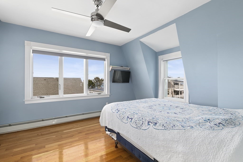 53 Prospect Avenue Winthrop, MA 02152 - Photo 13 of 18 a bedroom with a bed and a window