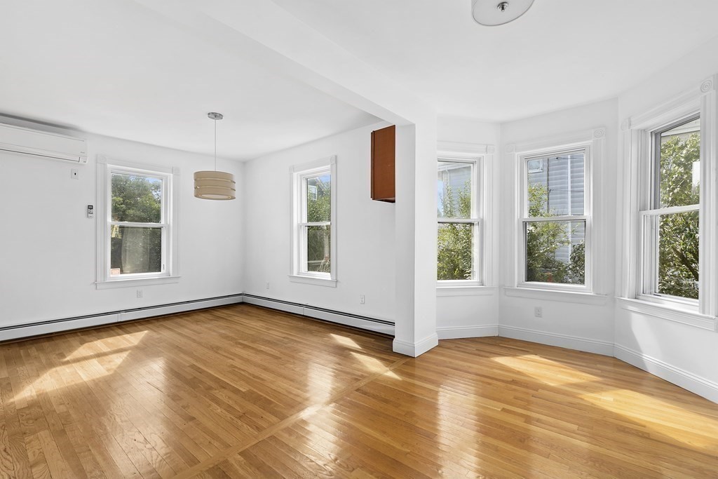 53 Prospect Avenue Winthrop, MA 02152 - Photo 5 of 18 a view of empty room with wooden floor and fan