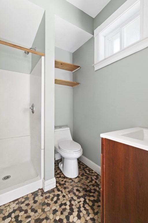 53 Prospect Avenue Winthrop, MA 02152 - Photo 9 of 18 a bathroom with a toilet and a shower