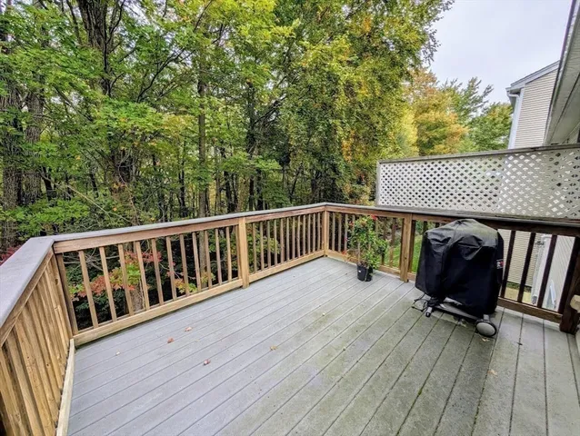 a room with a walk in closet and mirror