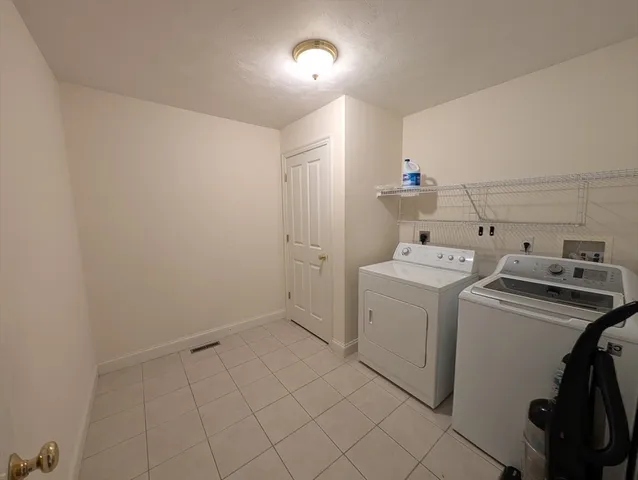 a kitchen with stainless steel appliances a refrigerator a stove a microwave oven with wooden floor