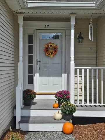 a vase of flowers sitting on a floor