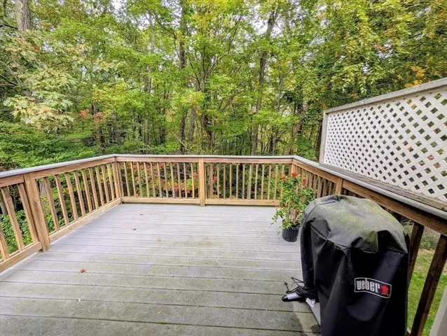 a view of balcony with wooden floor