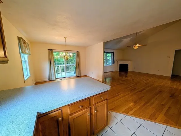 a view of kitchen with cabinets and wooden floor
