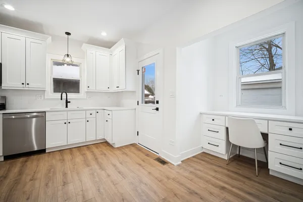 a view of kitchen with wooden floor