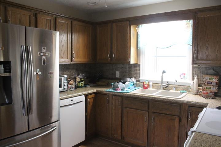 2075 Lock B Road North Clarksville, TN 37043 - Photo 13 of 26 a kitchen with a sink refrigerator and window