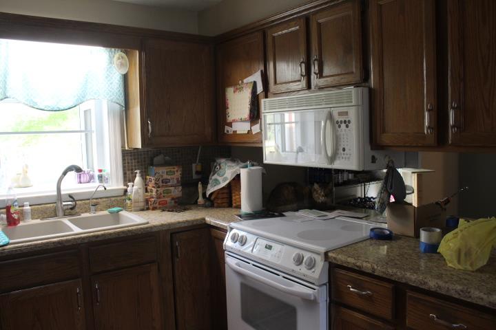 2075 Lock B Road North Clarksville, TN 37043 - Photo 14 of 26 a kitchen with a stove microwave and sink