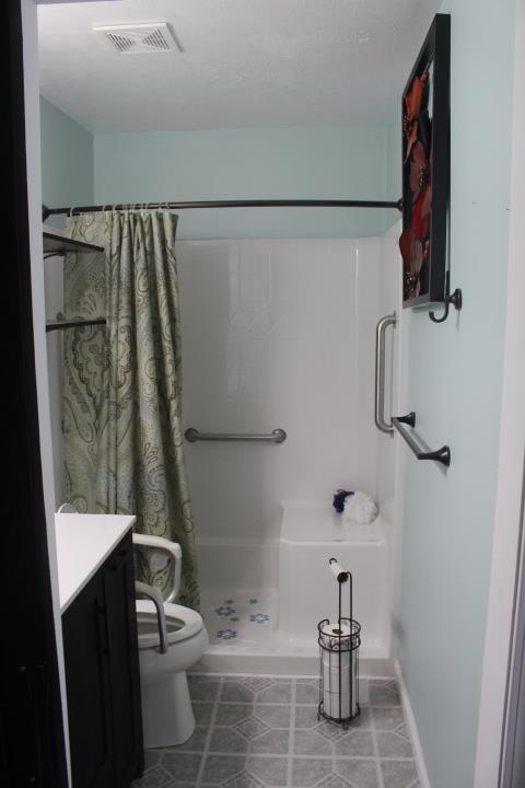 2075 Lock B Road North Clarksville, TN 37043 - Photo 19 of 26 a bathroom with a shower toilet and sink