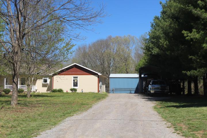 2075 Lock B Road North Clarksville, TN 37043 - Photo 2 of 26 a front view of a house with a yard