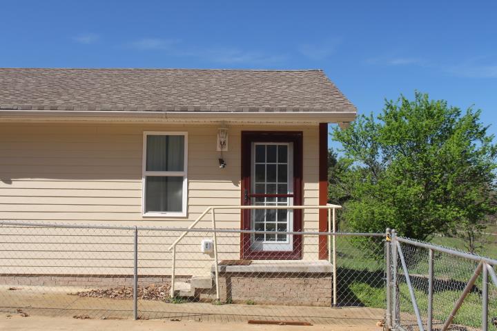 2075 Lock B Road North Clarksville, TN 37043 - Photo 22 of 26 a front view of a house with a garden