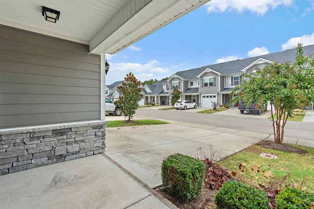 a view of a garden with a bench in patio