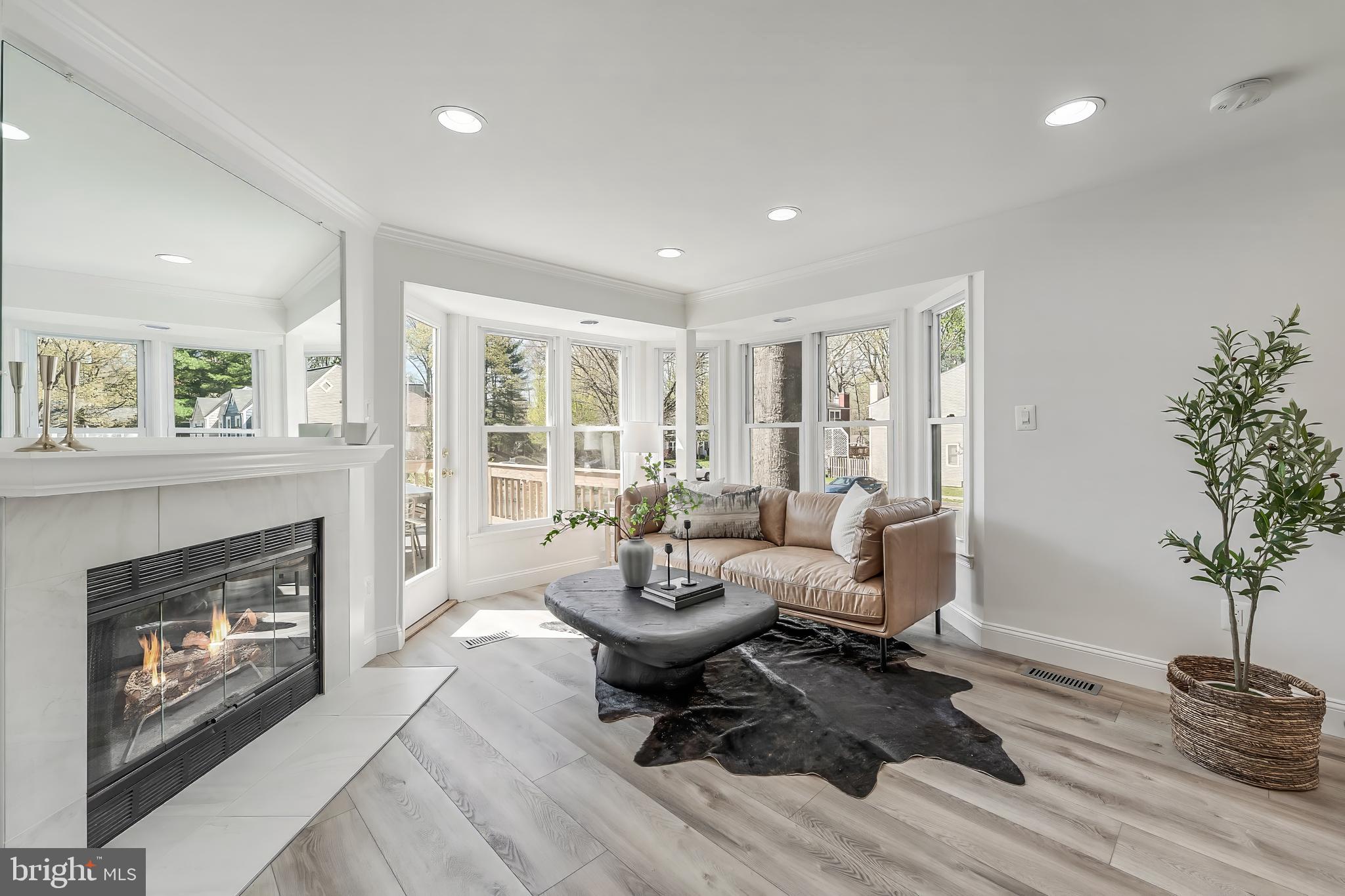 11257 Silentwood Lane Reston, VA 20191 - Photo 16 of 44 a living room with furniture and a fireplace