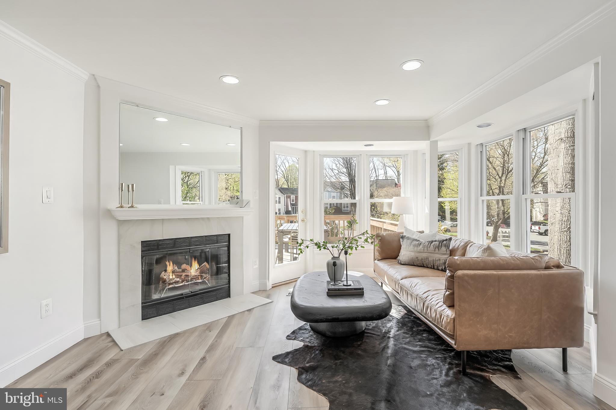 11257 Silentwood Lane Reston, VA 20191 - Photo 17 of 44 a living room with furniture and a fireplace