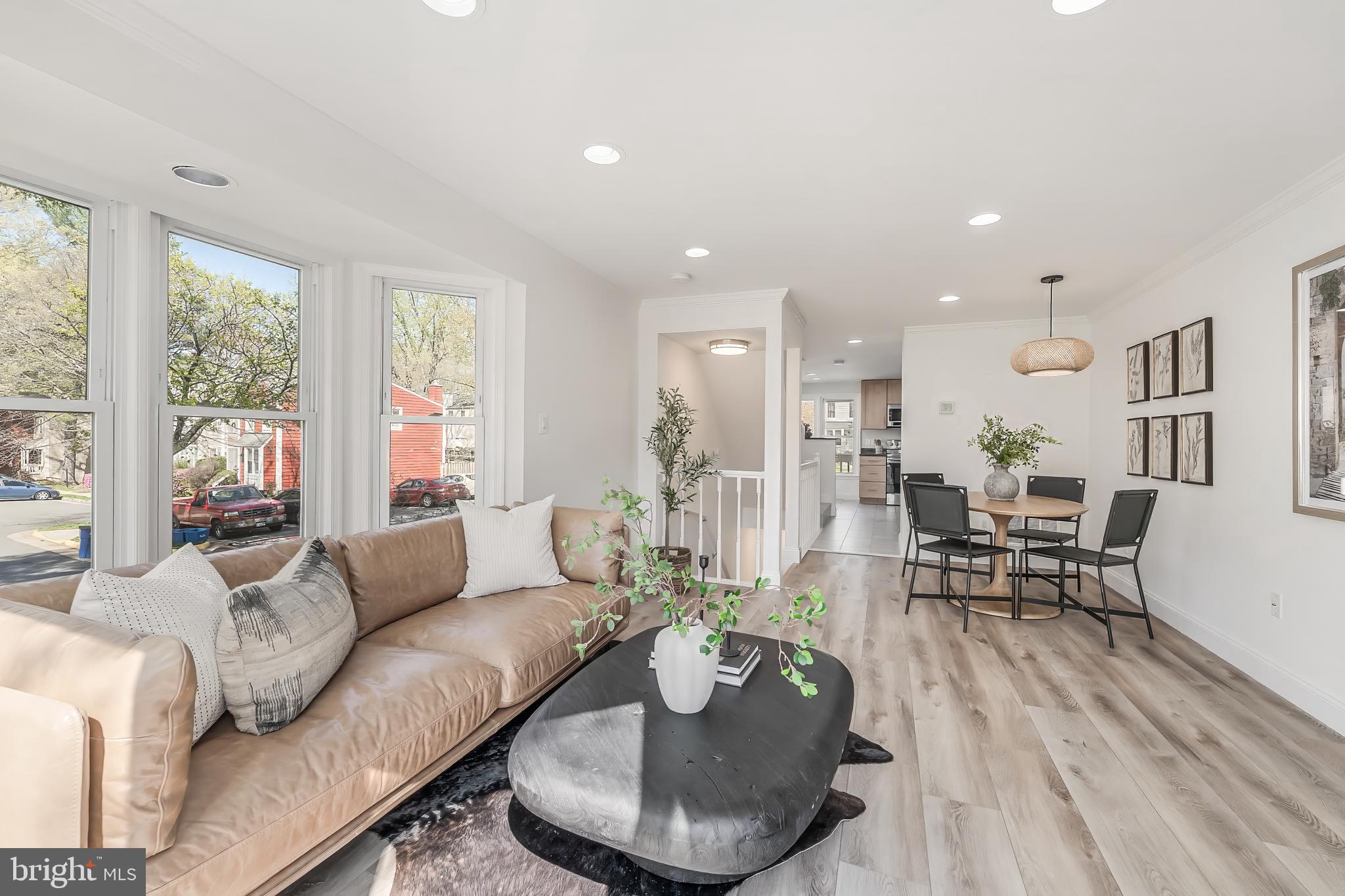 11257 Silentwood Lane Reston, VA 20191 - Photo 18 of 44 a living room with furniture and a table