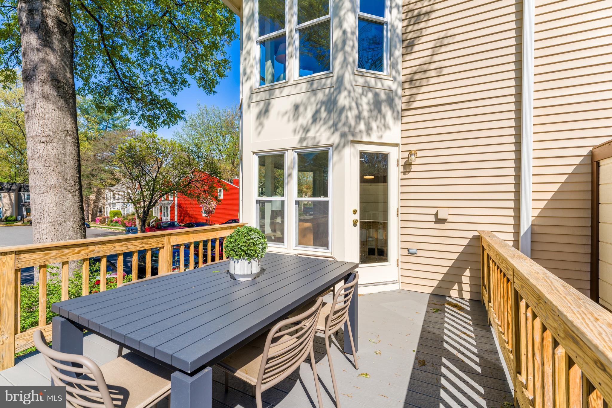 11257 Silentwood Lane Reston, VA 20191 - Photo 20 of 44 a view of a wooden chairs on the roof deck