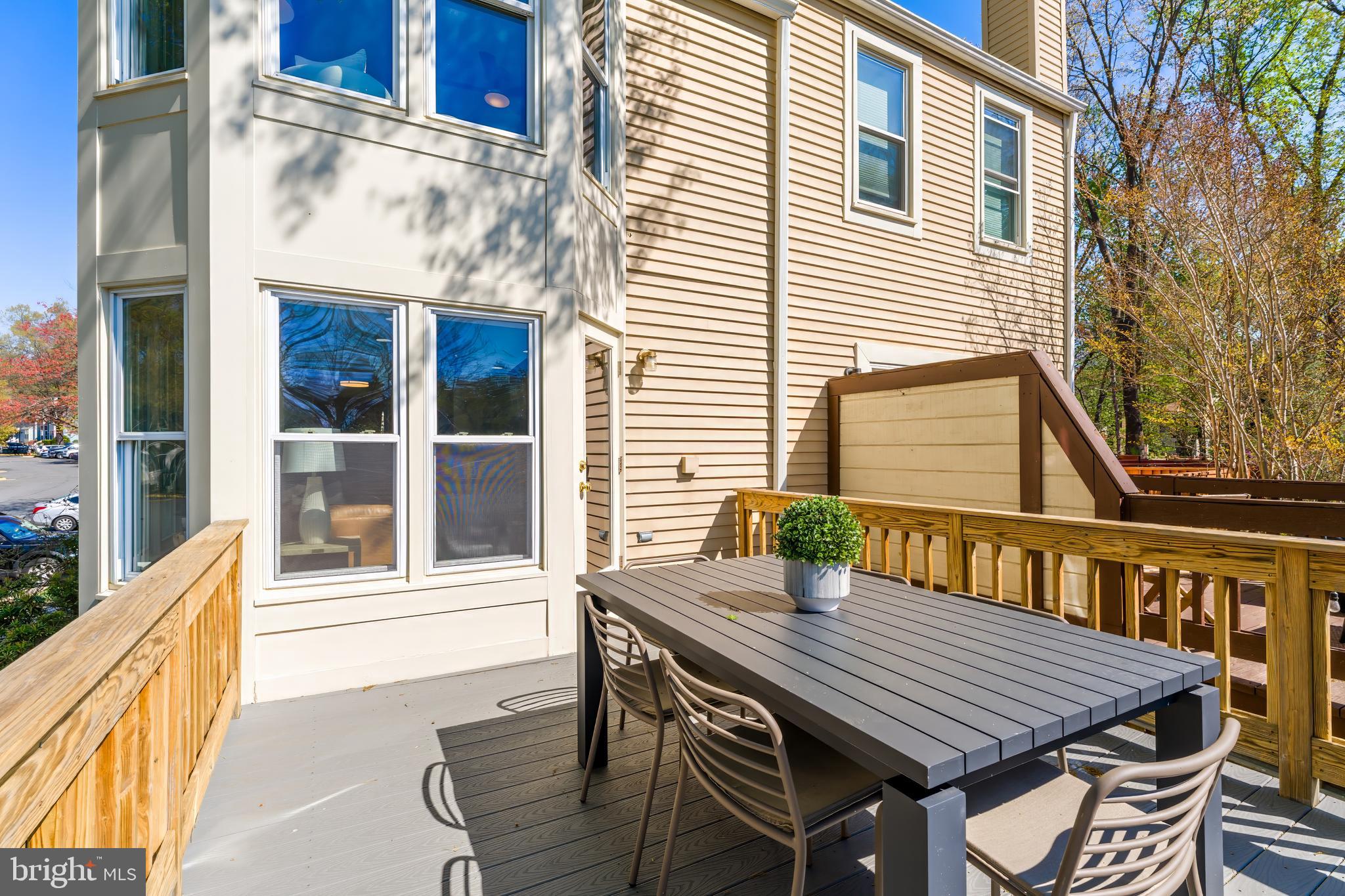 11257 Silentwood Lane Reston, VA 20191 - Photo 21 of 44 a view of a patio with a table and chairs