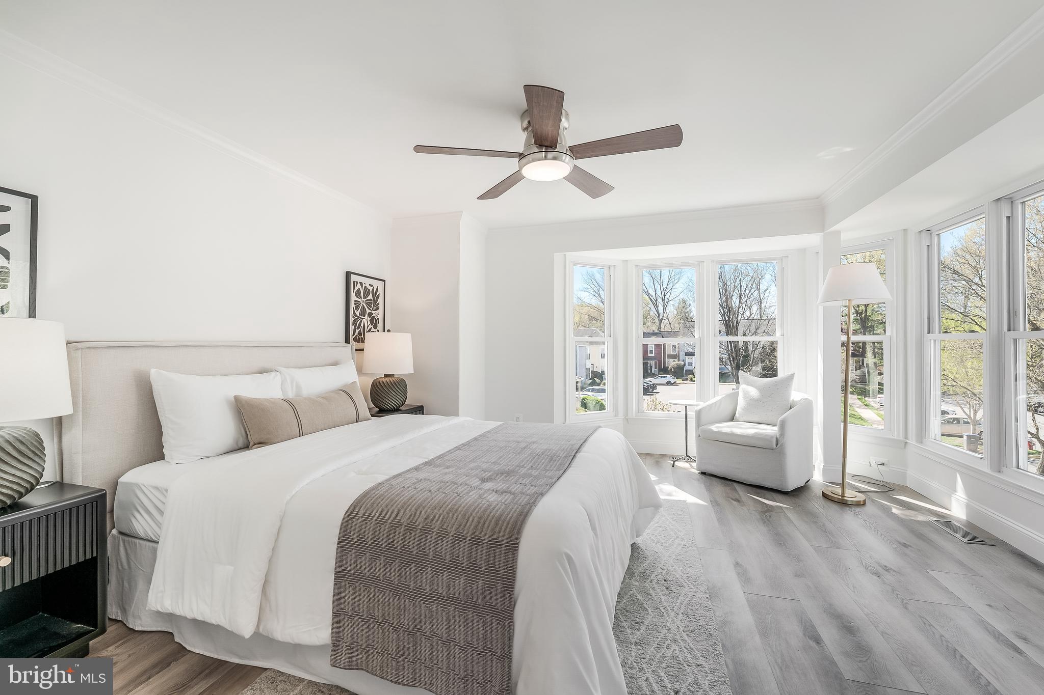 11257 Silentwood Lane Reston, VA 20191 - Photo 23 of 44 a bedroom with a large bed and wooden floor