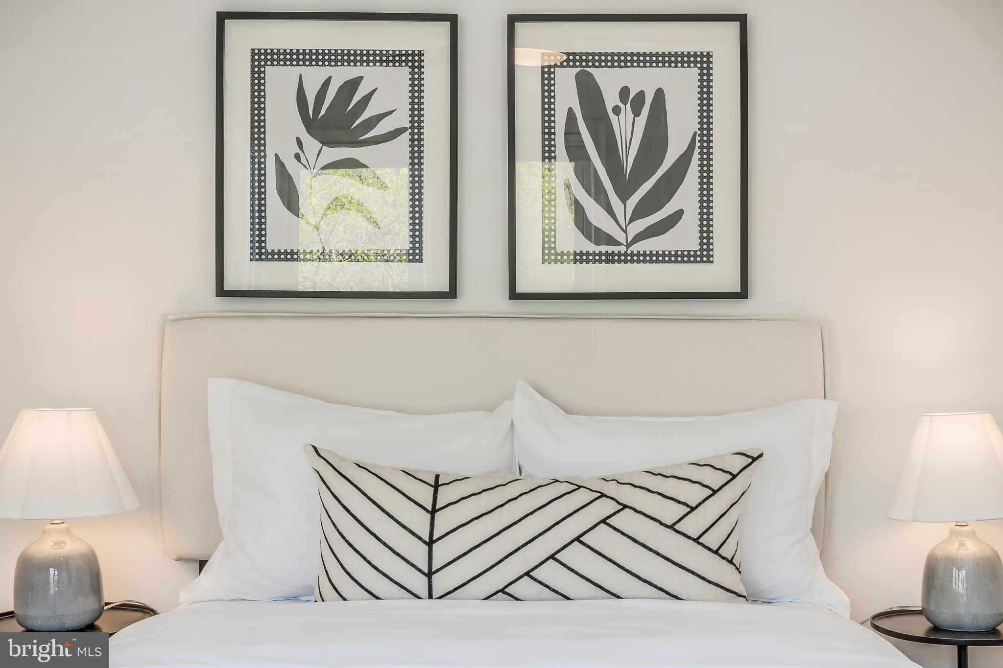 11257 Silentwood Lane Reston, VA 20191 - Photo 33 of 44 a bedroom with a bed and a painting on the wall