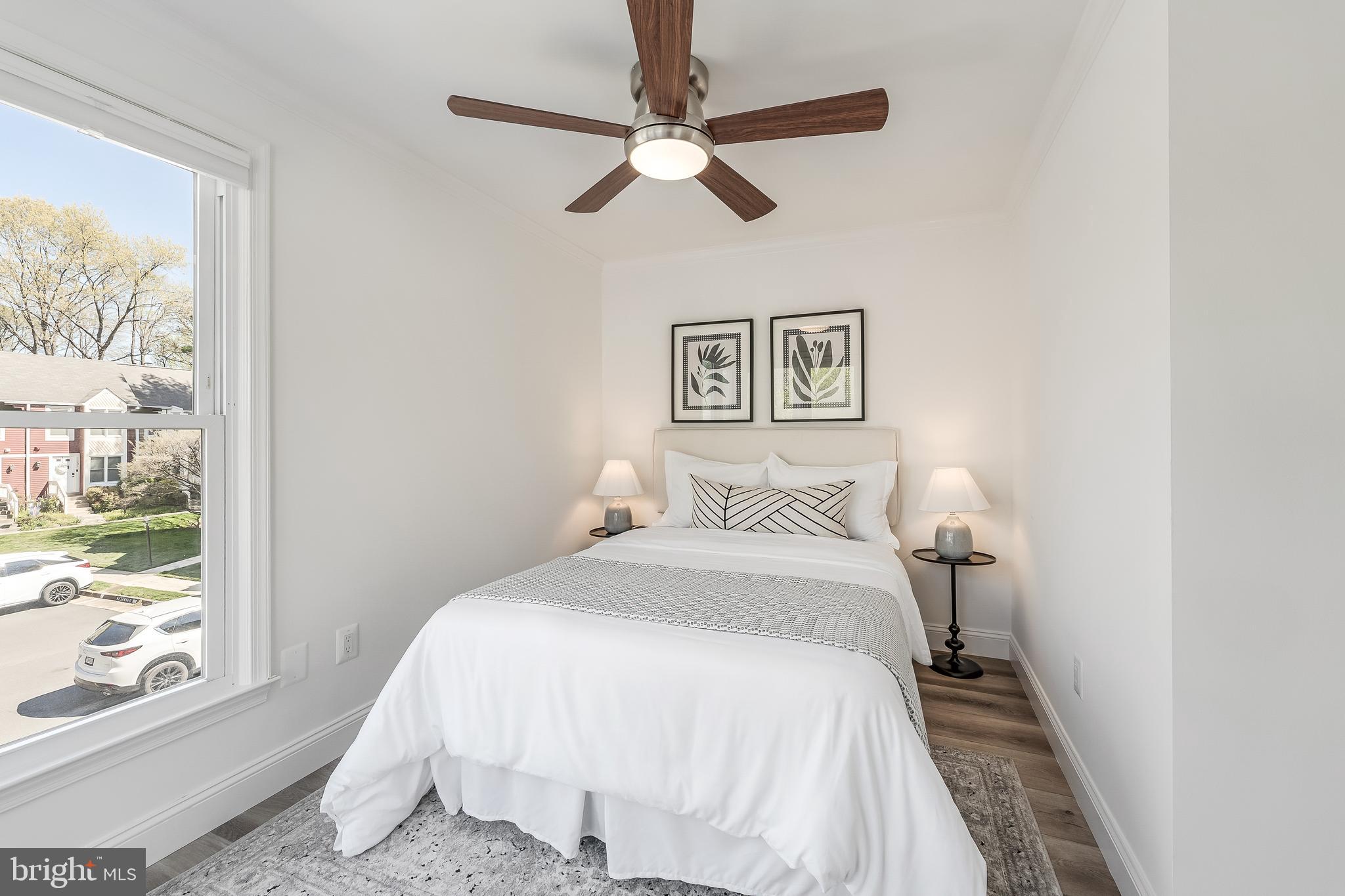 11257 Silentwood Lane Reston, VA 20191 - Photo 34 of 44 a bedroom with a bed and a window