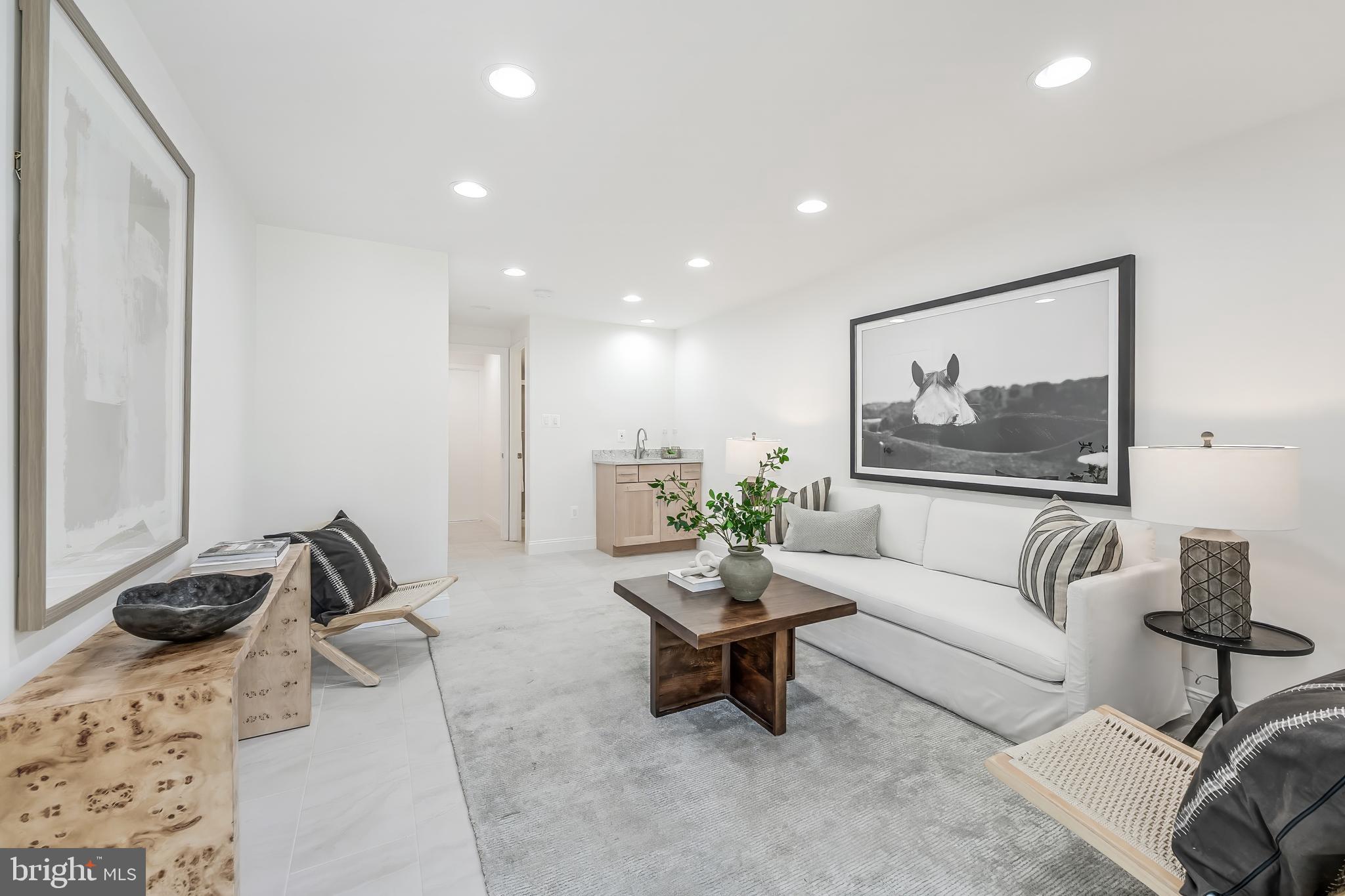 11257 Silentwood Lane Reston, VA 20191 - Photo 36 of 44 a living room with furniture and a large window